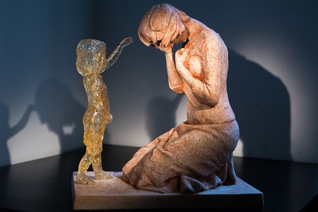 grieving woman and child